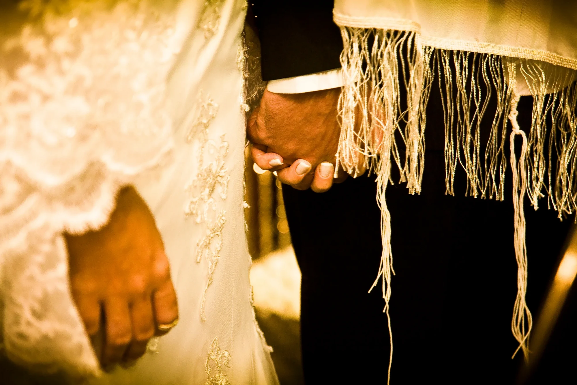 Elegant hands of a bride and groom at a wedding